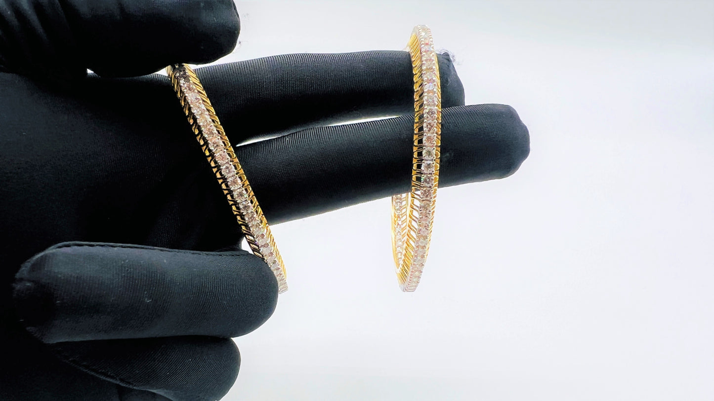 A beautiful gold diamond bangle pair with neatly set sparkling diamonds all around. The elegant design gives a timeless and classy look, making it perfect for everyday wear or special occasions.