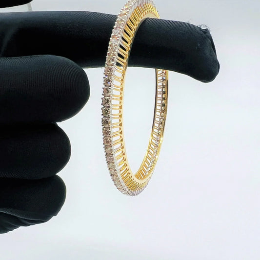 A beautiful gold diamond bangle pair with neatly set sparkling diamonds all around. The elegant design gives a timeless and classy look, making it perfect for everyday wear or special occasions.