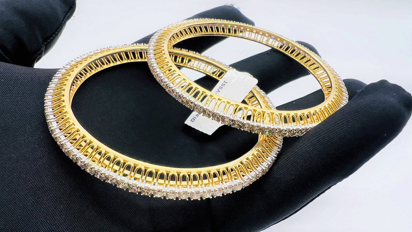 A beautiful gold diamond bangle pair with neatly set sparkling diamonds all around. The elegant design gives a timeless and classy look, making it perfect for everyday wear or special occasions.