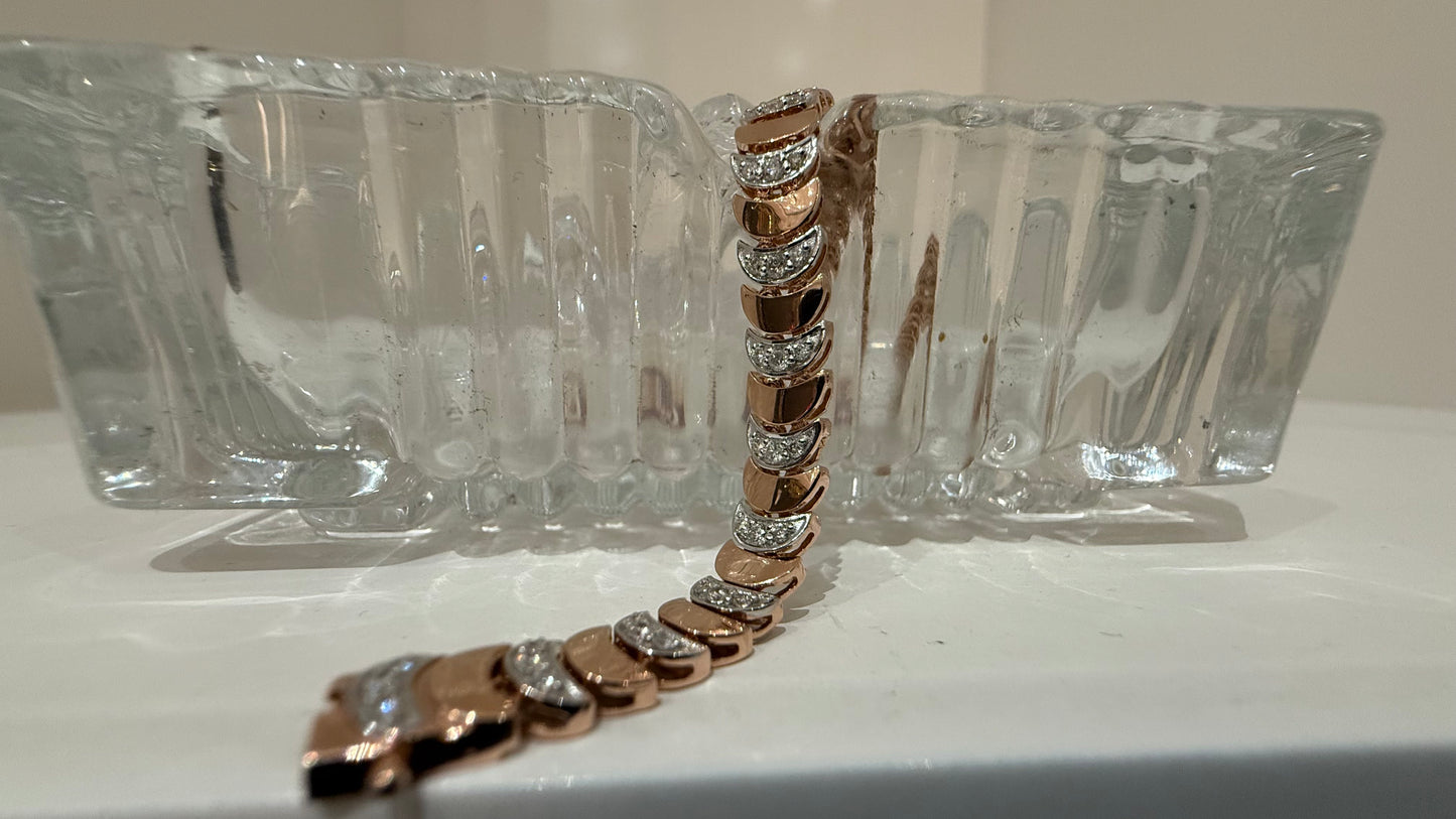 Elegant gold diamond bracelet crafted with unique crescent links and sparkling pavé-set diamonds.