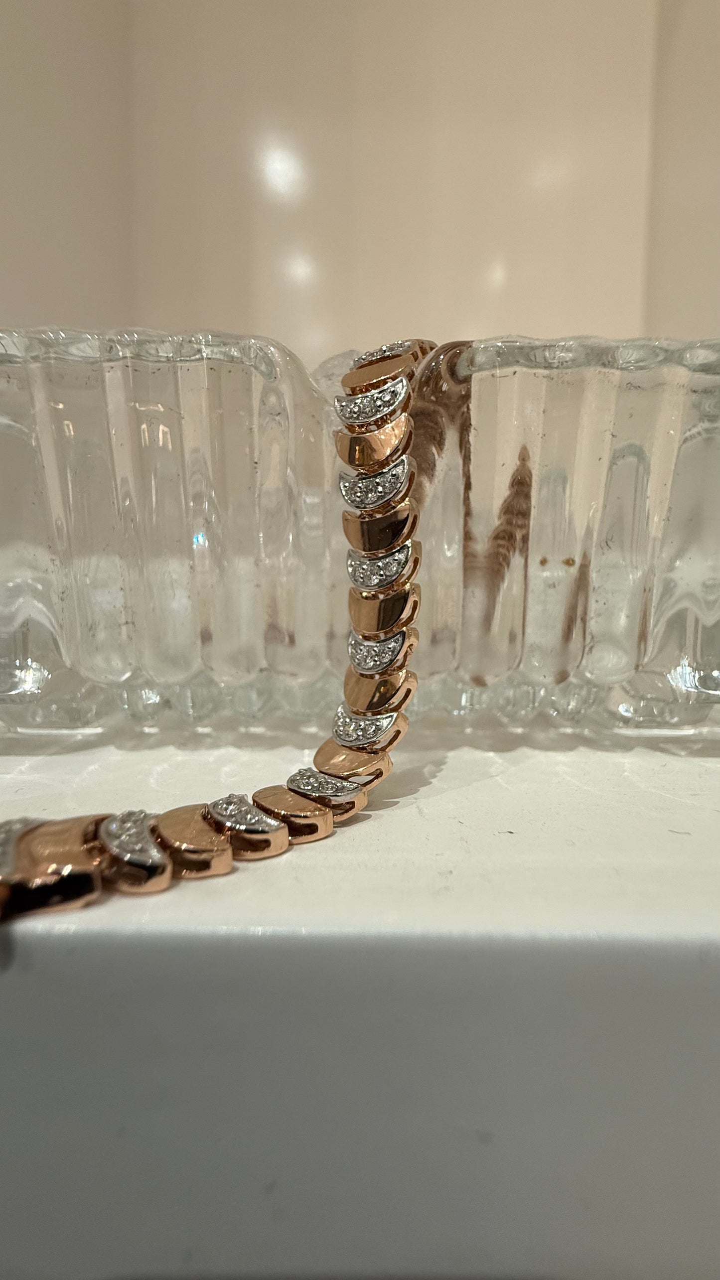 Elegant gold diamond bracelet crafted with unique crescent links and sparkling pavé-set diamonds.
