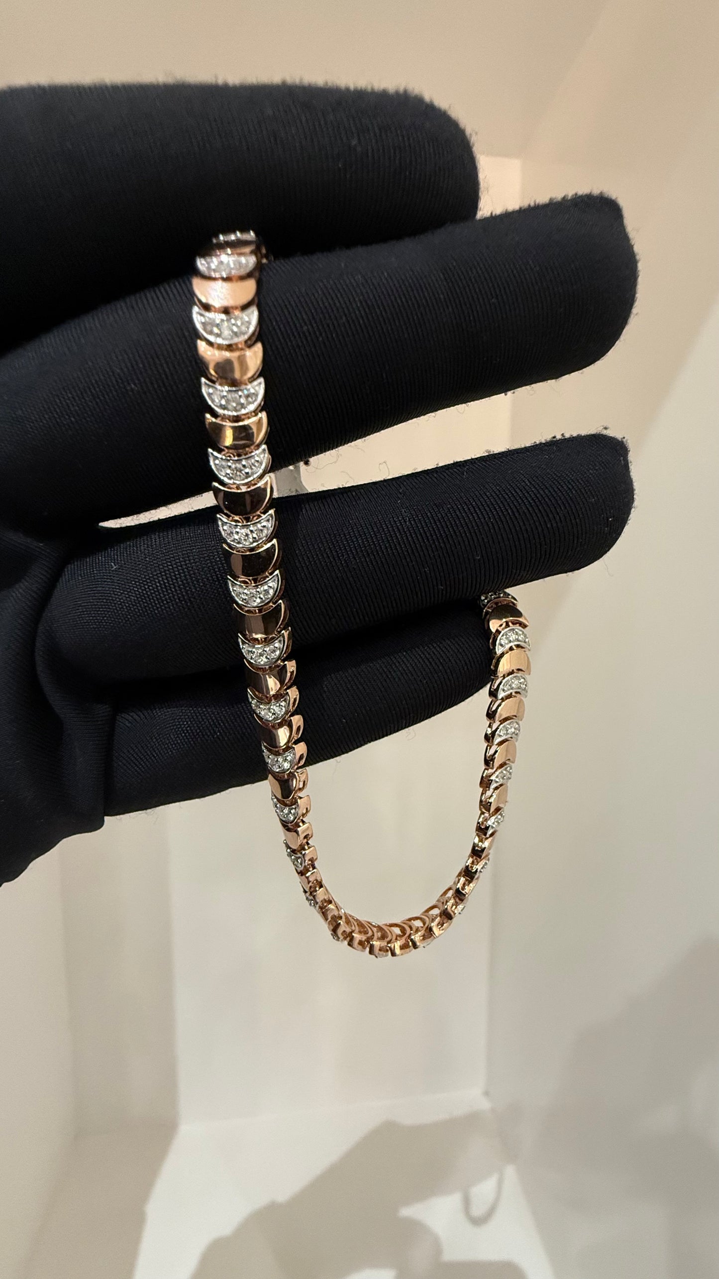 Elegant gold diamond bracelet crafted with unique crescent links and sparkling pavé-set diamonds.