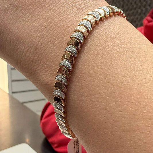 Elegant gold diamond bracelet crafted with unique crescent links and sparkling pavΓ©-set diamonds.