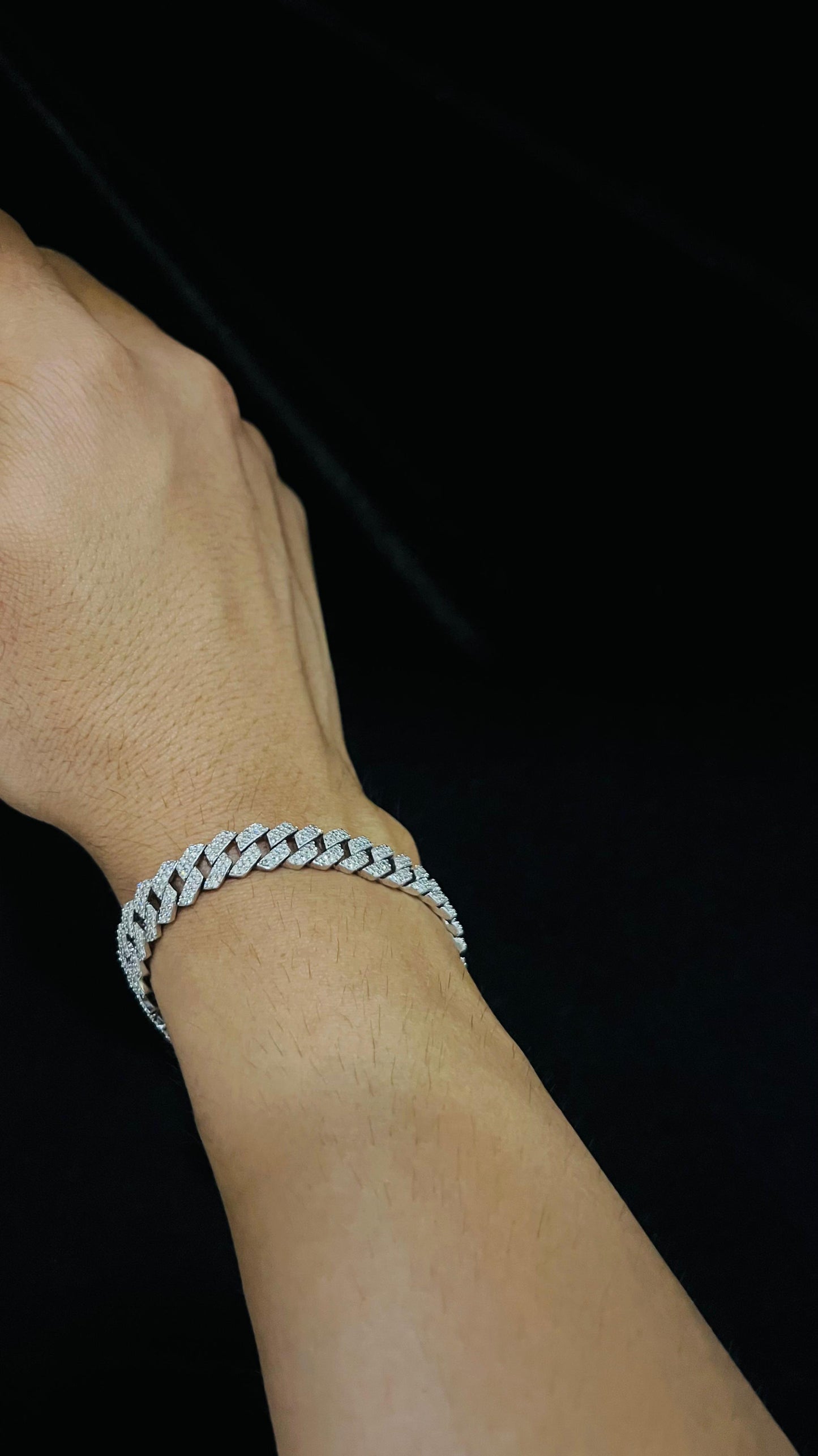 Stylish diamond Cuban chain bracelet with pavé-set diamonds, featuring bold interlocking links for a luxury statement look.