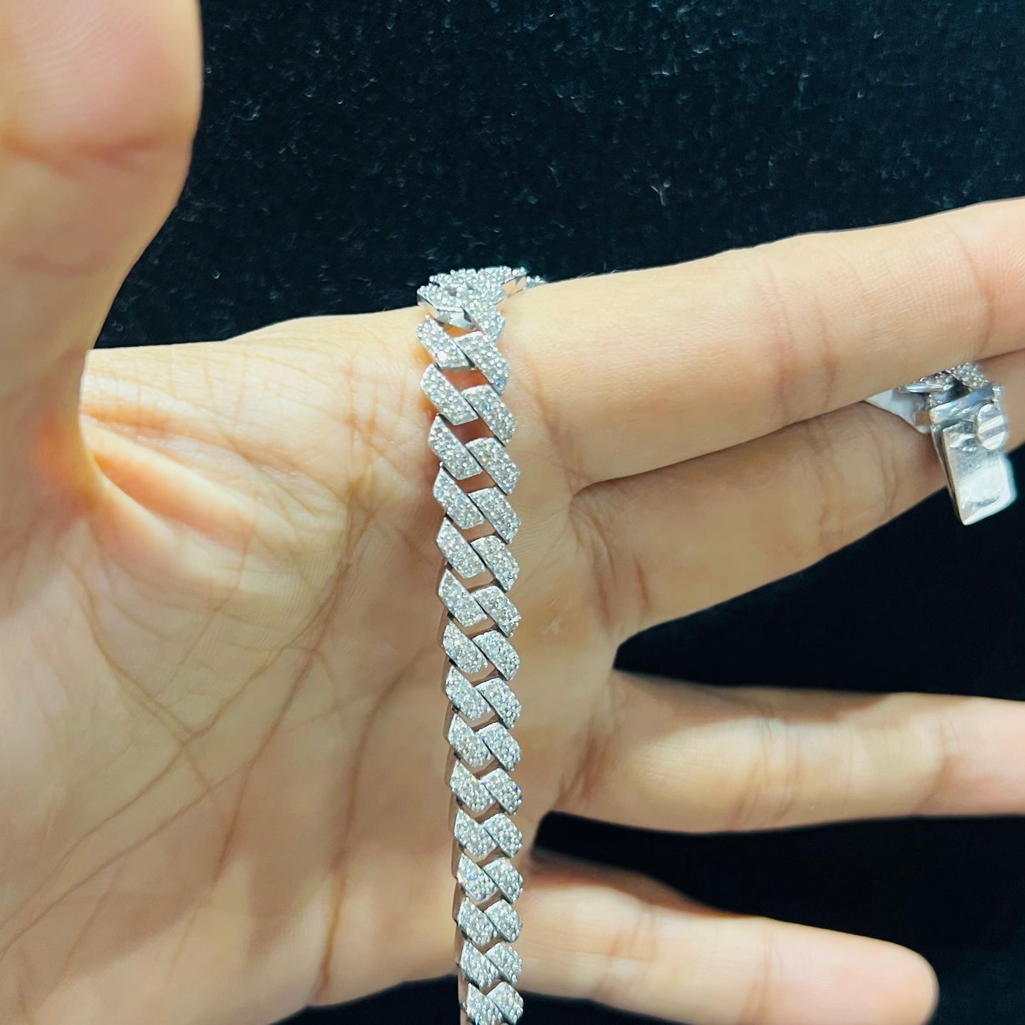 Stylish diamond Cuban chain bracelet with pavé-set diamonds, featuring bold interlocking links for a luxury statement look.