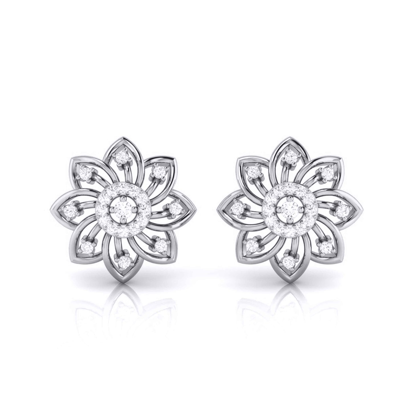 Pair of white gold flower-shaped earrings with clear gemstones on a white background