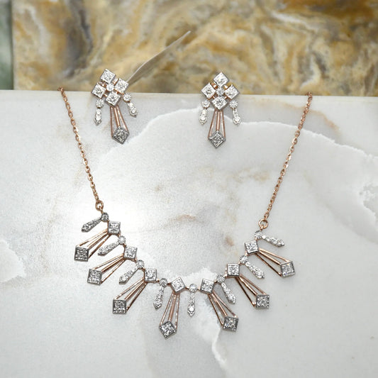 Diamond necklace and matching earrings on a marble surface
