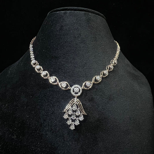 Radiant cascade diamond necklace set displayed on black velvet bust