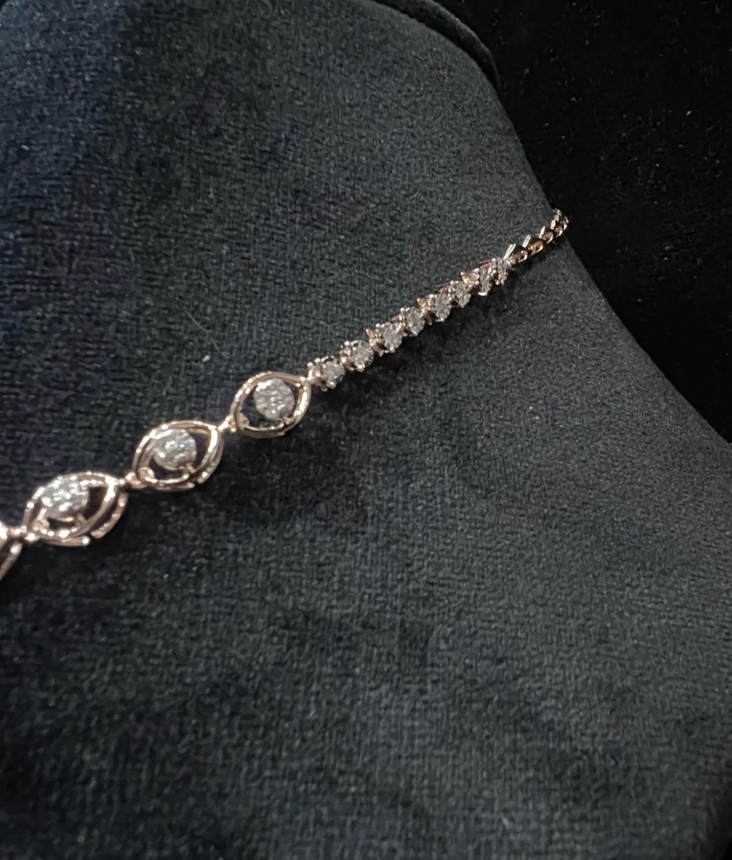 Radiant cascade diamond necklace set from side angle displayed on black velvet bust