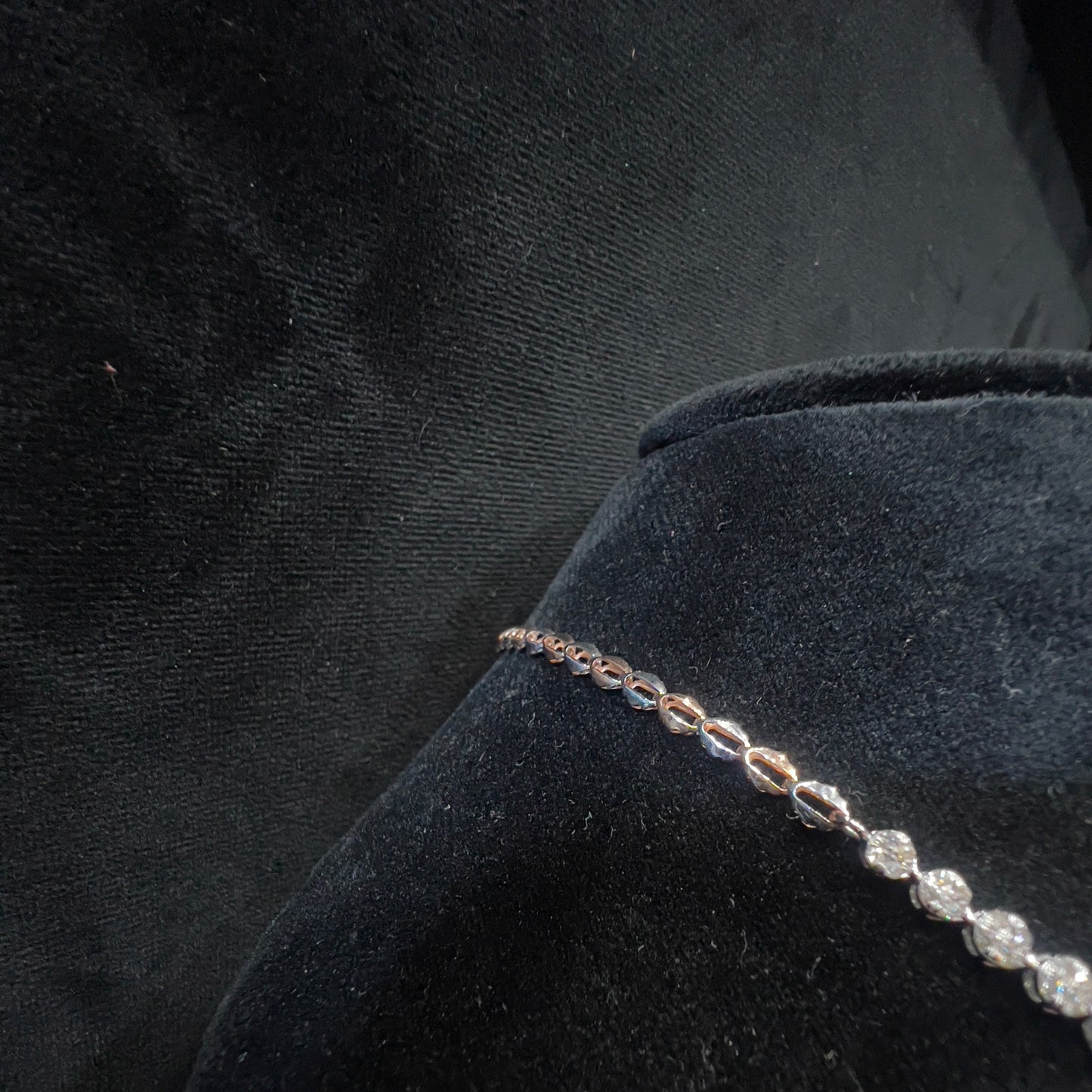 backside of diamond necklace set is showing on the mannequin.