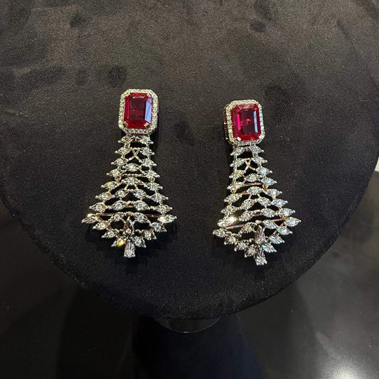 Color stone and diamond earrings is displayed on a mannequin.