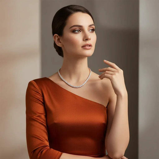 Woman wearing a real diamond tennis necklace against a neutral background