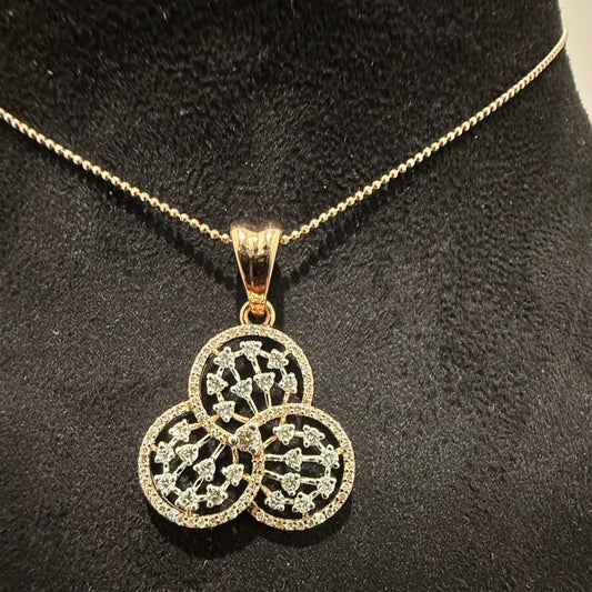 A gold diamond pendant with a floral design, displayed on a black mannequin necklace stand.
