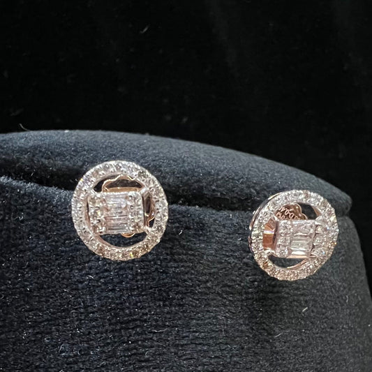 A mannequin showcasing a gold diamond earrings displayed.