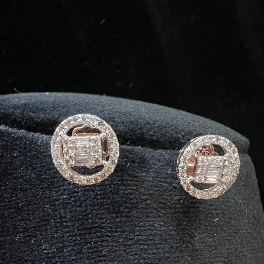 A mannequin showcasing a gold diamond earrings displayed.