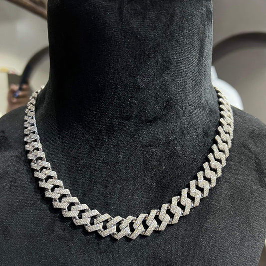Luxury gold Cuban chain necklace with pavé-set diamonds and bold interlocking links for a stylish statement look.