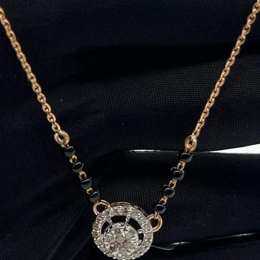 Elegant gold diamond mangalsutra with round halo diamond pendant and dual black bead gold chain, perfect for daily wear and modern bridal style.