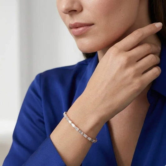 Woman wearing a lab grown diamond bracelet on a blurred background