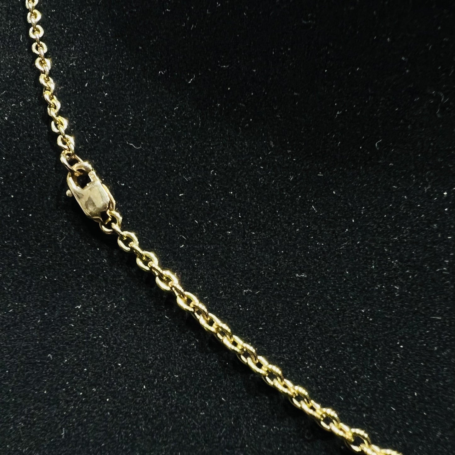 Gold chain on a black background