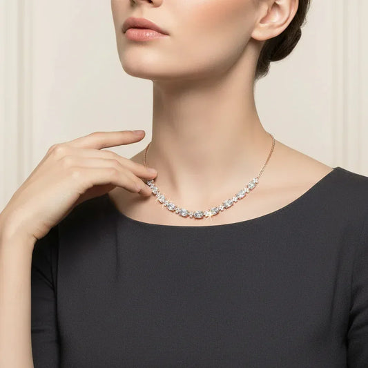 Woman wearing a lab grown diamond necklace against a neutral background