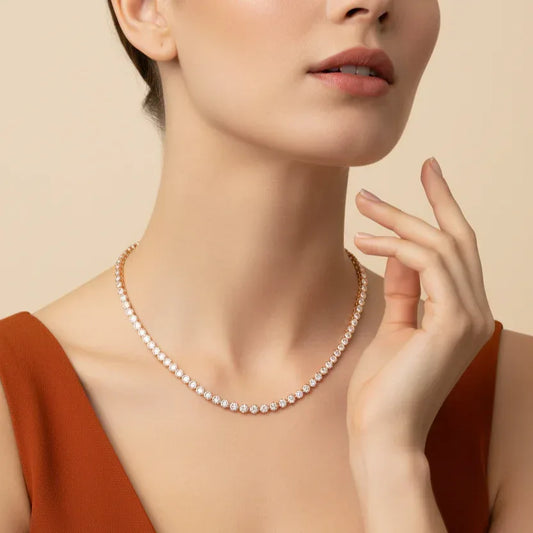 Woman wearing a lab grown diamond necklace with a neutral background