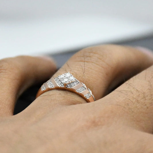 Close-up of a hand wearing a diamond ring with a blurred background