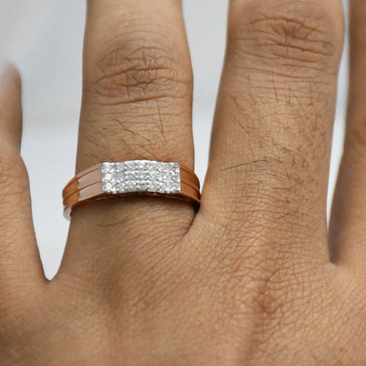 Close-up of a hand wearing a diamod ring with a gold band on a white background