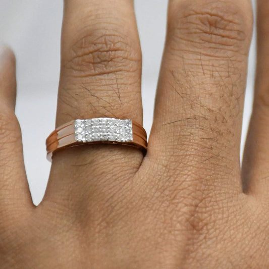 Close-up of a hand wearing a diamod ring with a gold band on a white background