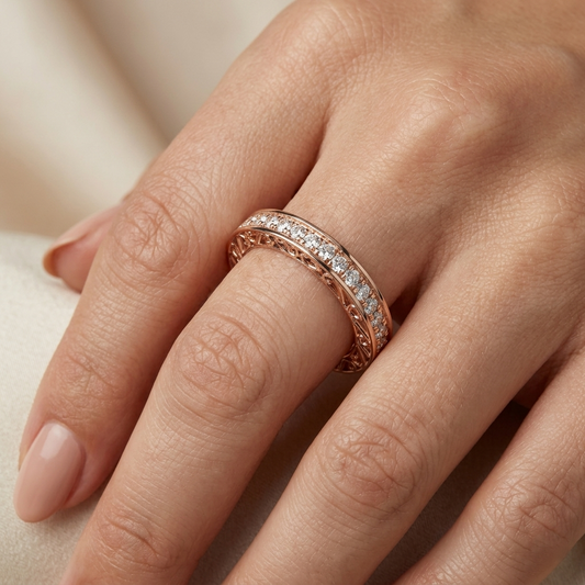 Rose gold ring with natural diamonds on a hand against a neutral background
