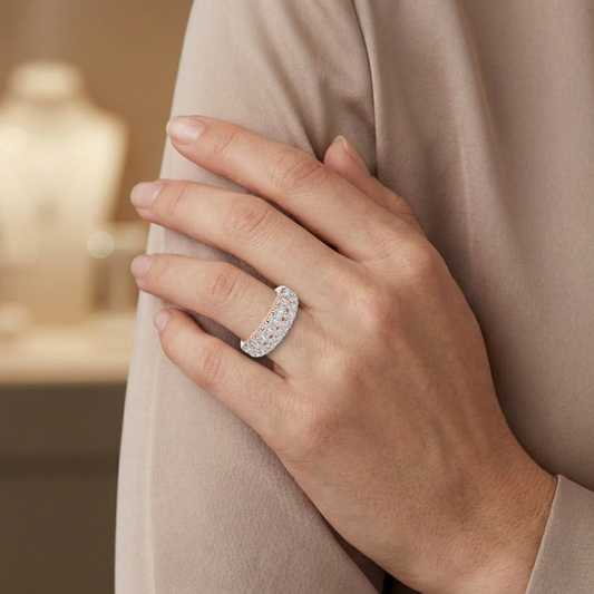 Hand wearing a lab grown diamond ring with a blurred background