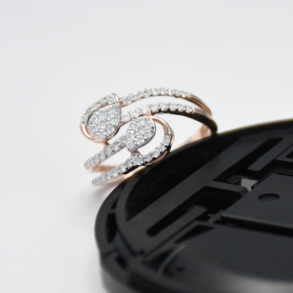 gold ring with diamonds on a black phone case against a white background