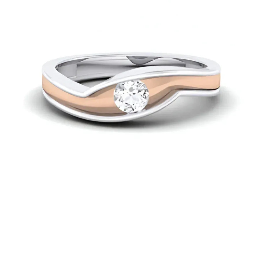 Two-tone ring with a diamond on a white background