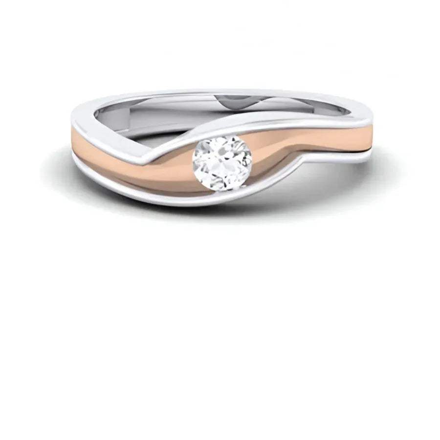 Two-tone ring with a diamond on a white background