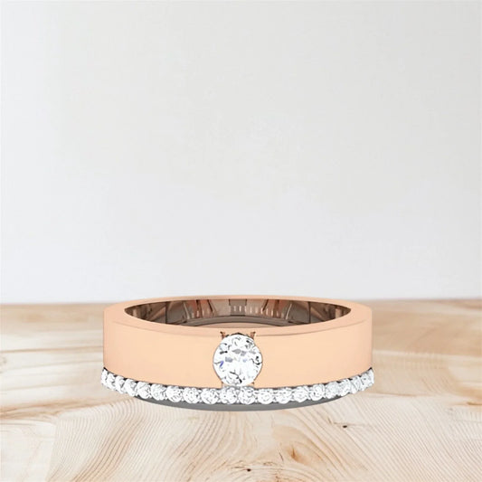 Rose gold ring with a diamond on a wooden surface