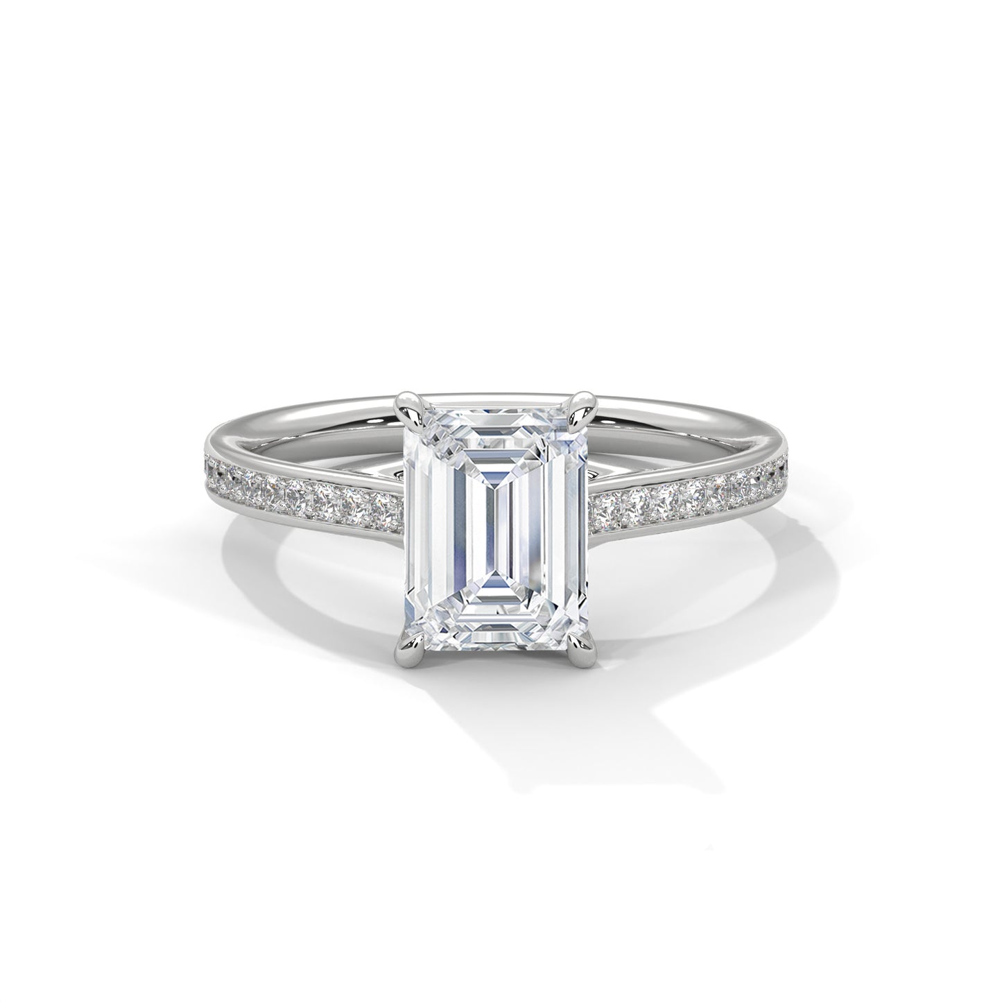 Diamond ring with emerald-cut center stone on a white background