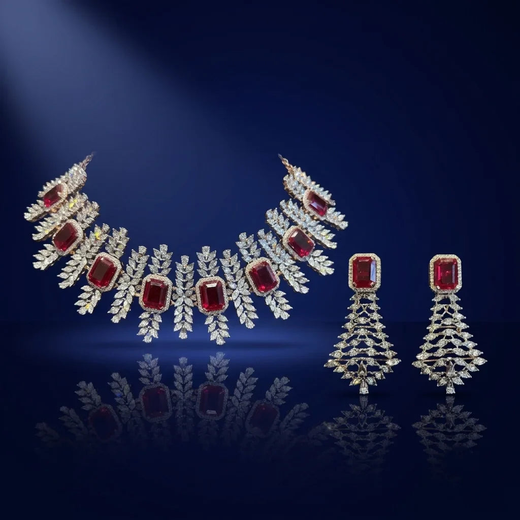 Jewelry set with necklace and earrings featuring red gemstones on a dark blue background