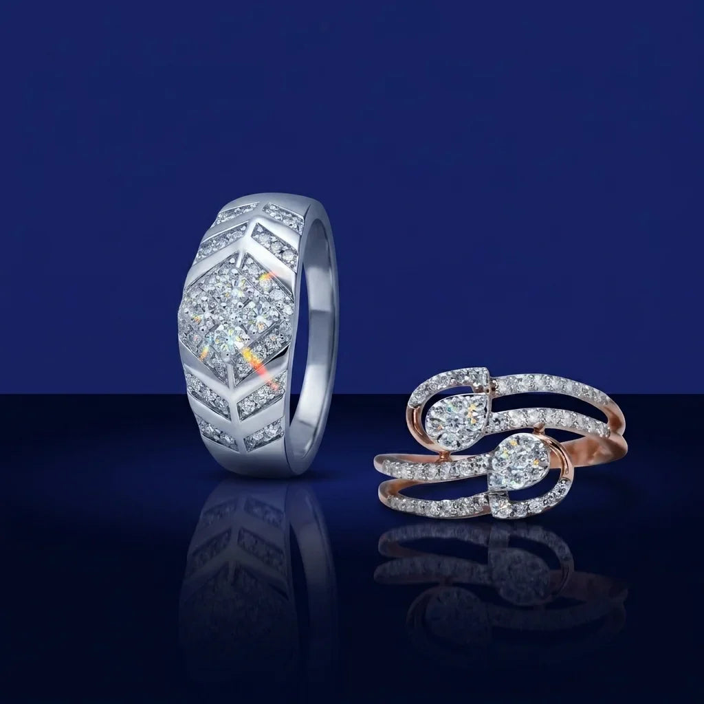 Two diamond rings on a reflective surface with a dark blue background
