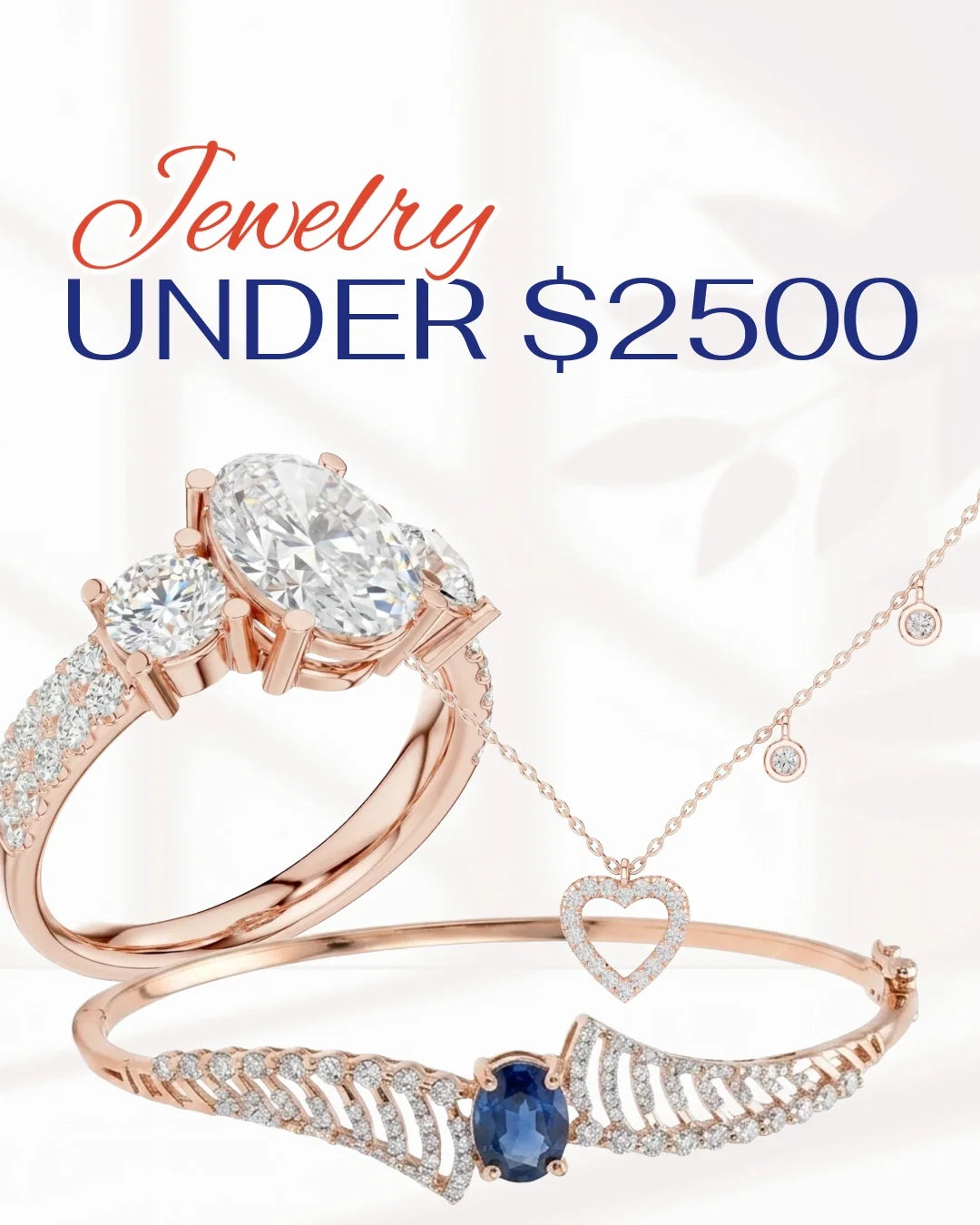 Rose gold jewelry set featuring an oval-cut ring, a heart-shaped pendant necklace, and a wing-shaped bangle bracelet, all adorned with clear stones and a blue sapphire accent, with promotional text 'Jewelry UNDER $2500' on a white background.