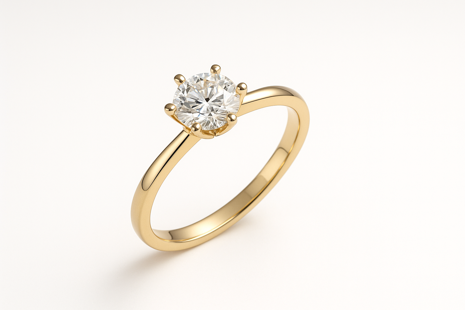 Gold ring with a diamond on a white background
