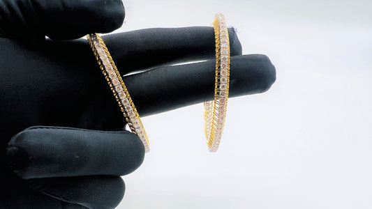 A beautiful gold diamond bangle pair with neatly set sparkling diamonds all around. The elegant design gives a timeless and classy look, making it perfect for everyday wear or special occasions.