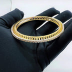 A beautiful gold diamond bangle pair with neatly set sparkling diamonds all around. The elegant design gives a timeless and classy look, making it perfect for everyday wear or special occasions.