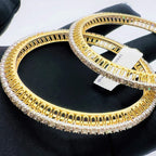 A beautiful gold diamond bangle pair with neatly set sparkling diamonds all around. The elegant design gives a timeless and classy look, making it perfect for everyday wear or special occasions.