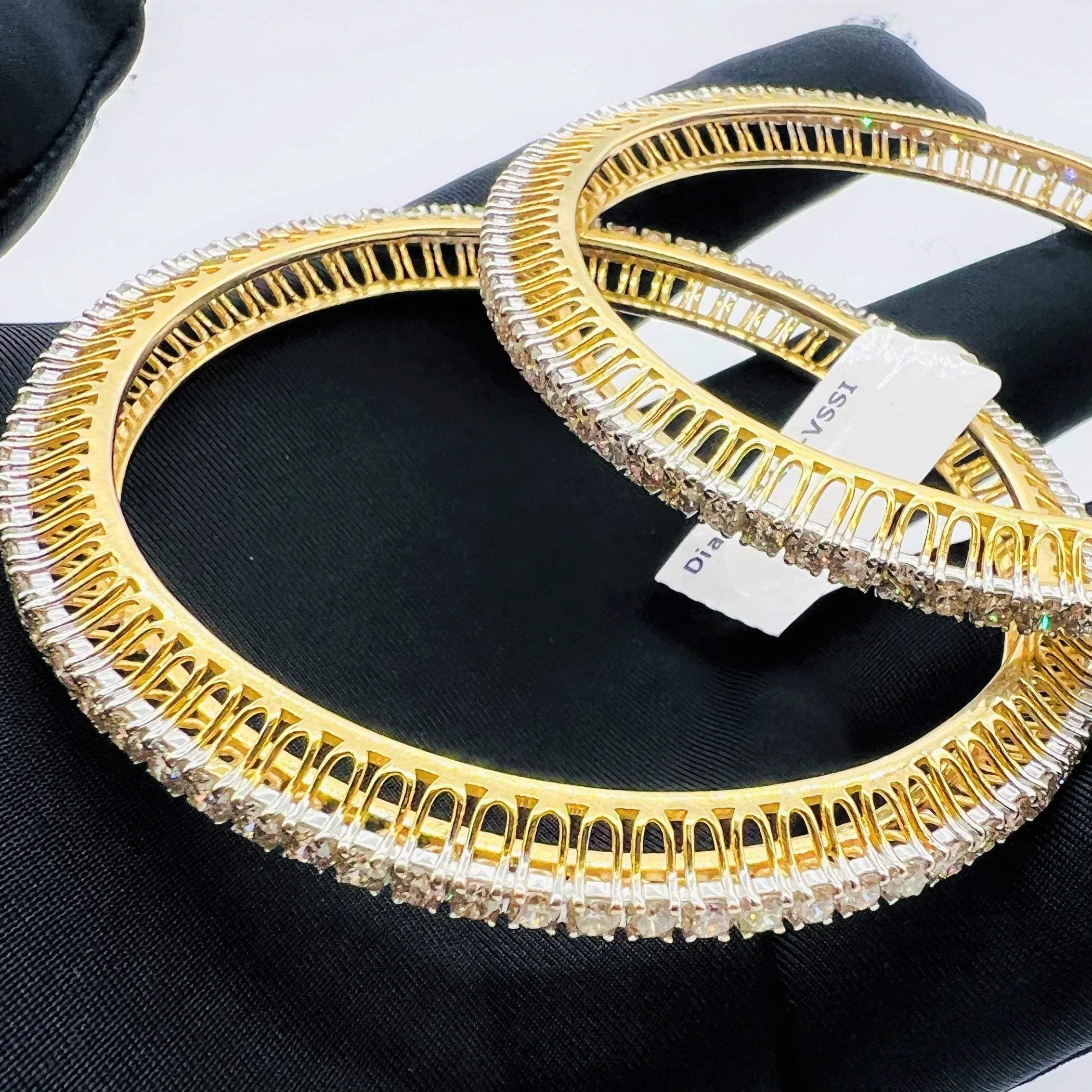 A beautiful gold diamond bangle pair with neatly set sparkling diamonds all around. The elegant design gives a timeless and classy look, making it perfect for everyday wear or special occasions.
