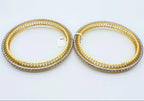 A beautiful gold diamond bangle pair with neatly set sparkling diamonds all around. The elegant design gives a timeless and classy look, making it perfect for everyday wear or special occasions.