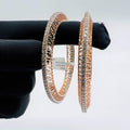 Elegant rose gold diamond bangle set with designer cutwork and round-cut diamonds, perfect for gifting and special occasions.