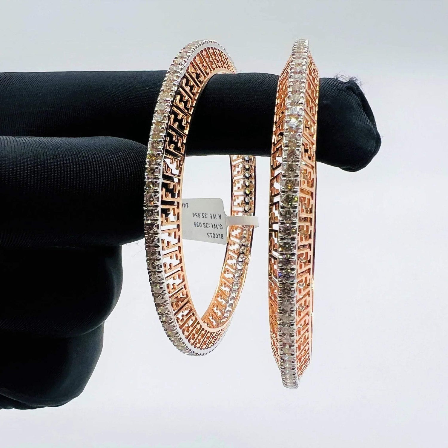 Elegant rose gold diamond bangle set with designer cutwork and round-cut diamonds, perfect for gifting and special occasions.