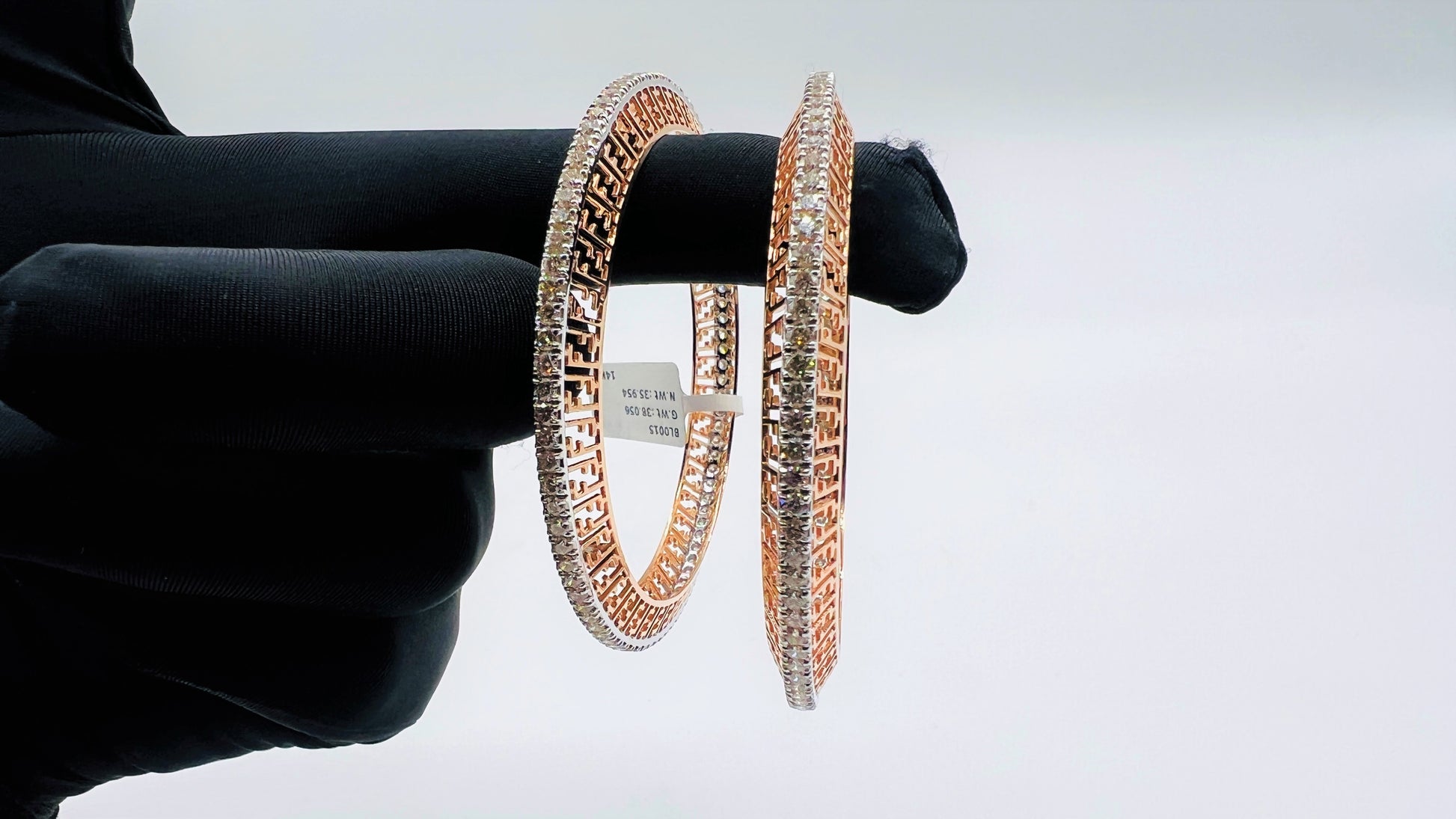 Elegant rose gold diamond bangle set with designer cutwork and round-cut diamonds, perfect for gifting and special occasions.