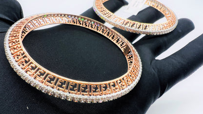 Side view of rose gold diamond bangle set featuring fine diamond lining and modern cutwork design in 14k gold.