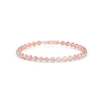 Rose gold bracelet with small diamonds on a white background