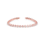 Rose gold bracelet with small diamonds on a white background